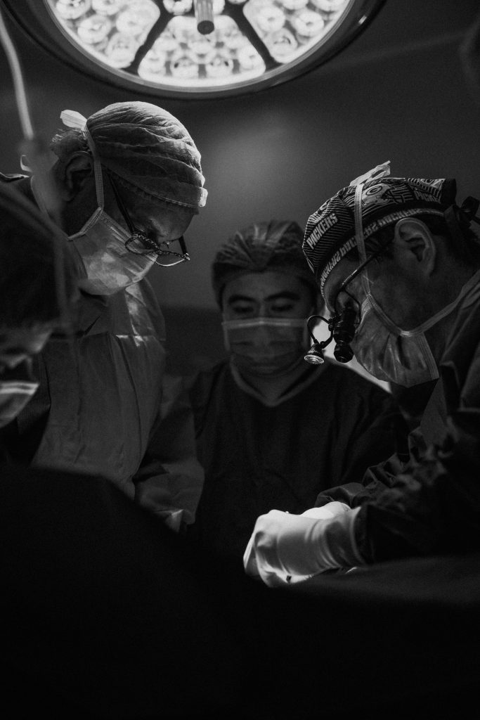Doctors operating on patient Photo by JC Gellidon on Unsplash