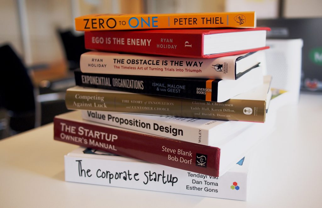A stack of startup books. Do everything you want, but not all at once.